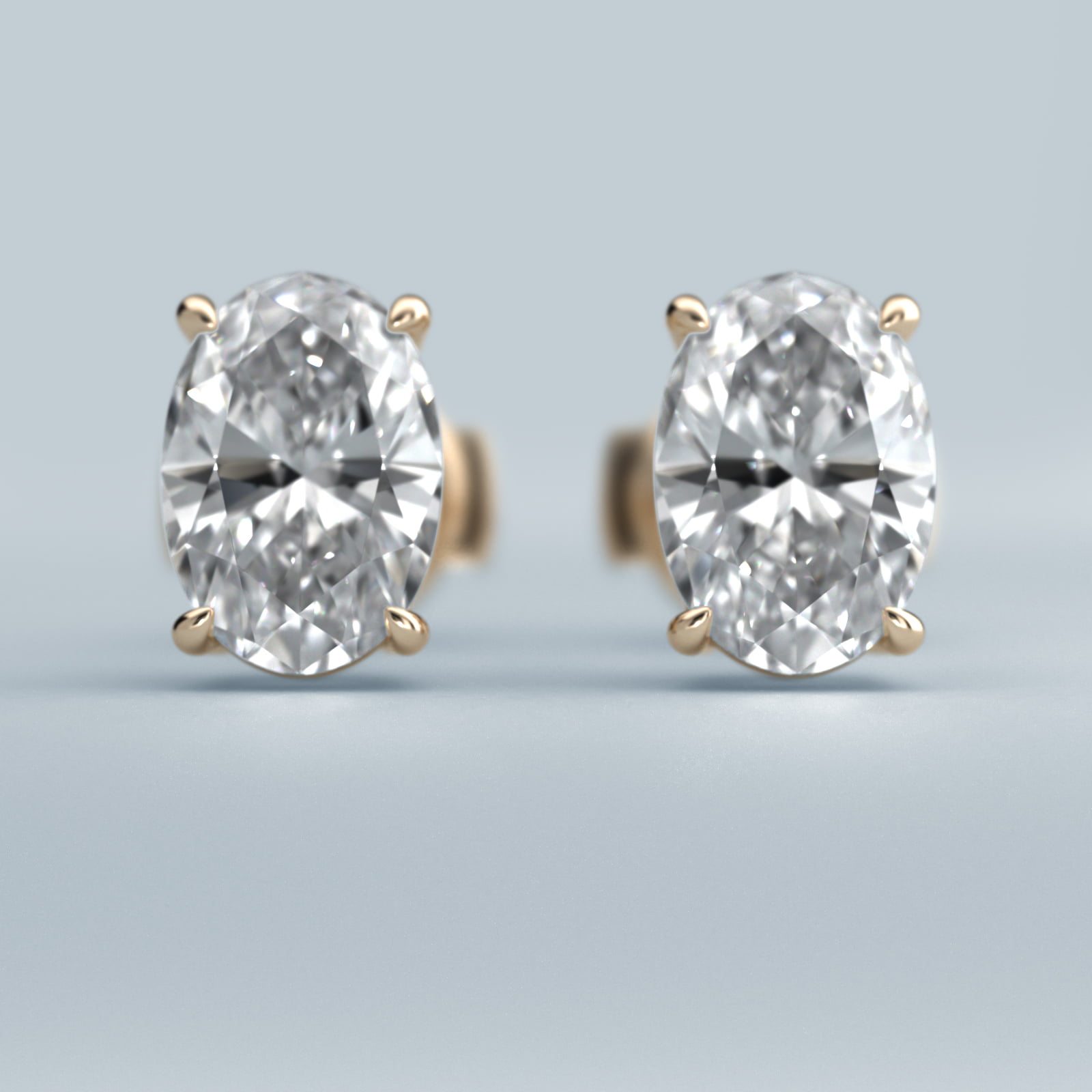 Oval Cut Diamond Stud Earrings    In 14K Yellow Gold (Setting)