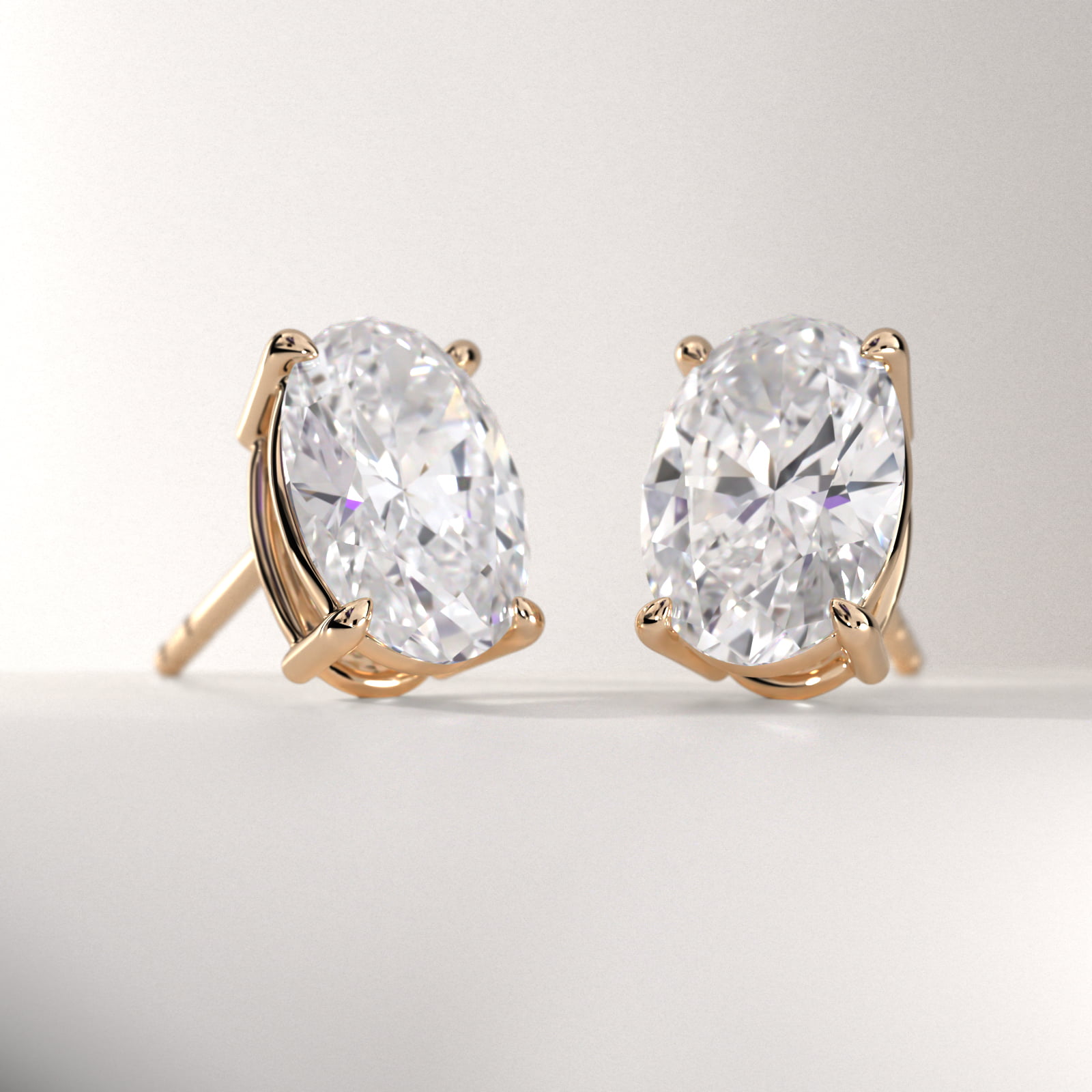 Oval Cut Diamond Stud Earrings    In 18K Yellow Gold (Setting)