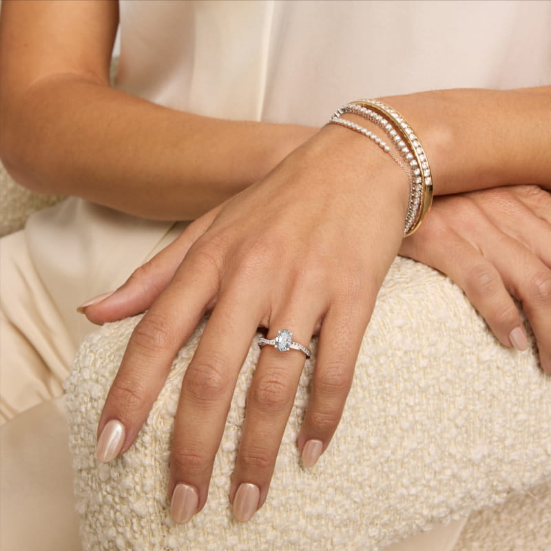 Oval Cut 2.5 CT Certified Lab-Grown Diamond Petite Twist Engagement Ring In 14K White Gold