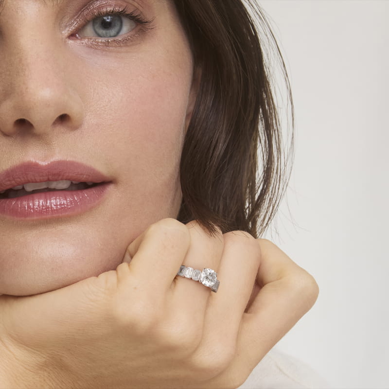 Bezel Set Emerald Cut Side Stone Diamond Engagement Ring In Platinum