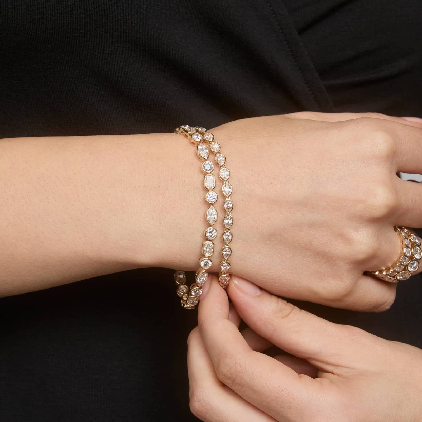 East-West Bezel Tennis Bracelet With 5 CTW Pear Shaped Diamonds in 14K Yellow Gold