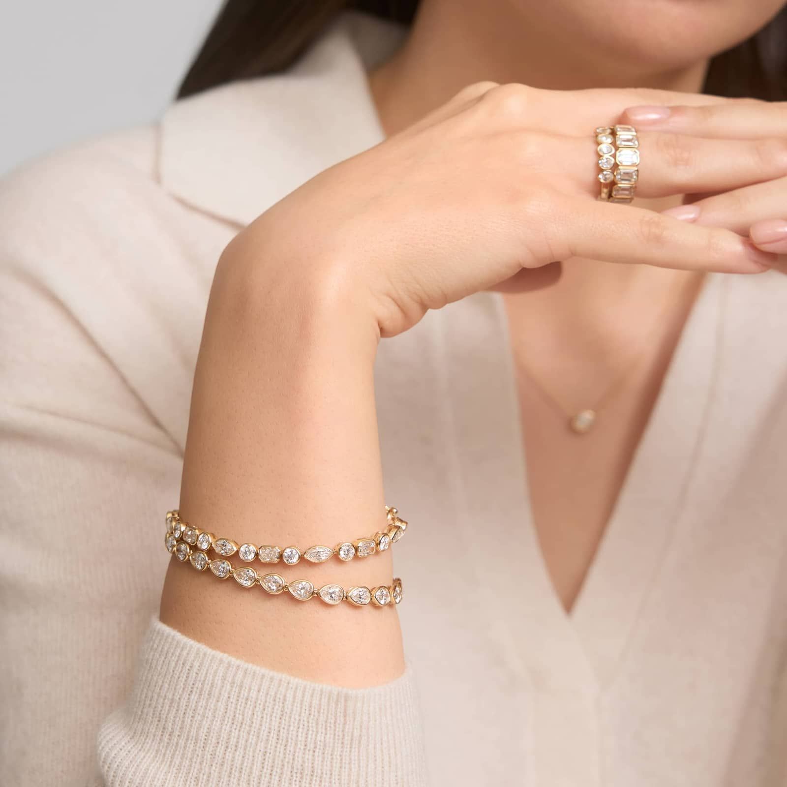 East-West Bezel Tennis Bracelet With 10 CTW Pear Shaped Diamonds in 14K Yellow Gold