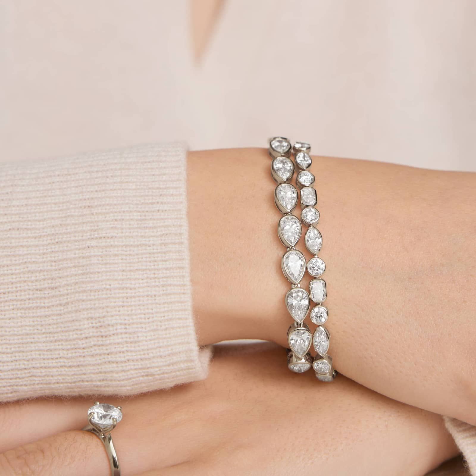 East-West Bezel Tennis Bracelet With 15 CTW Pear Shaped Lab-Grown Diamonds in 14K White Gold