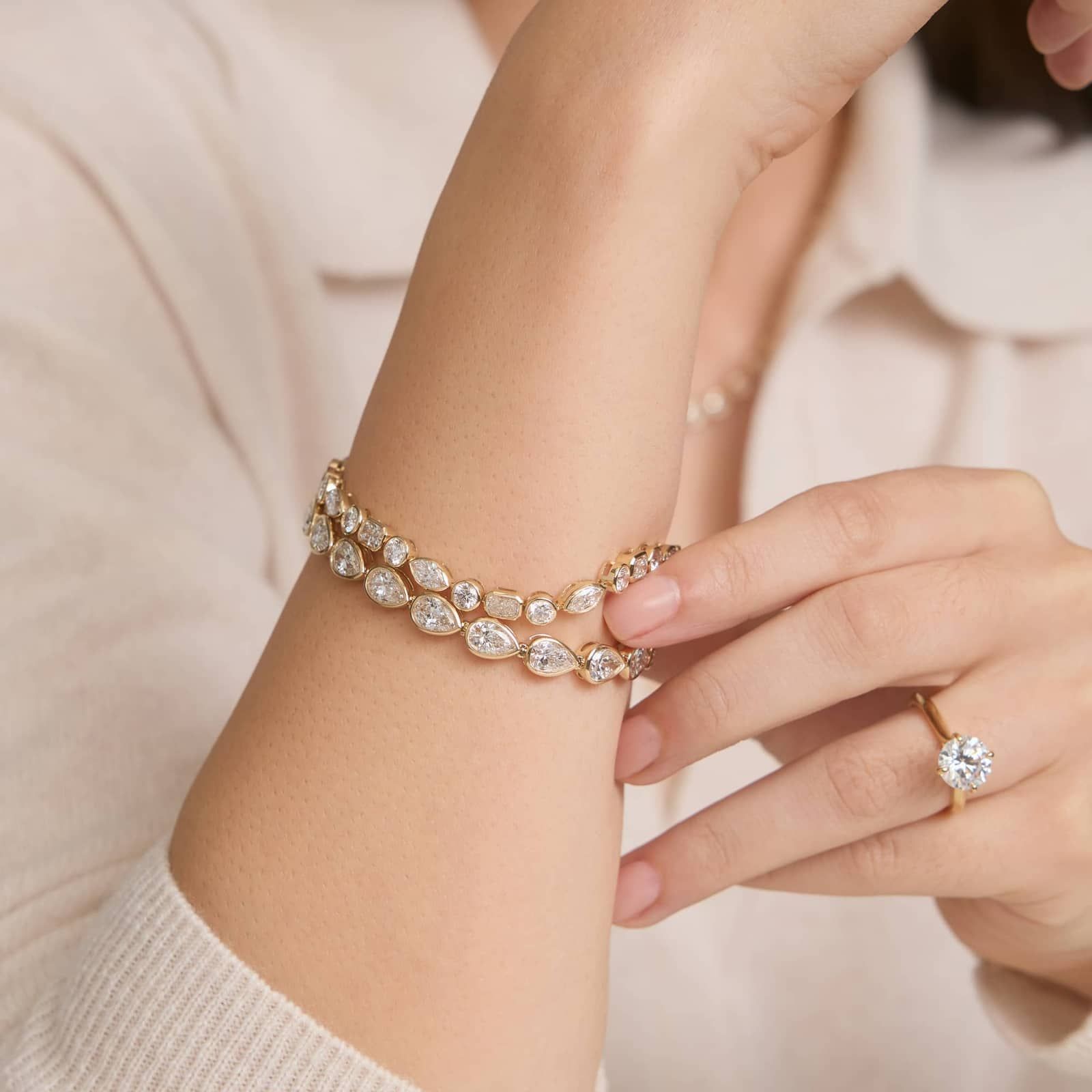 East-West Bezel Tennis Bracelet With 15 CTW Pear Shaped Lab-Grown Diamonds in 14K Yellow Gold