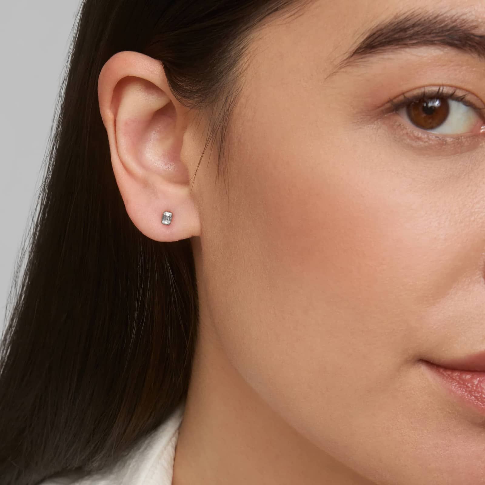 Bezel Set Emerald Cut Diamond Stud Earrings In 14K White Gold (1/4 Ct. tw. - H-I / SI1-SI2)