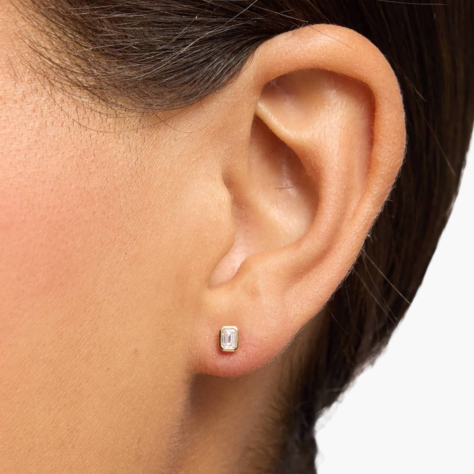 Bezel Set Emerald Cut Diamond Stud Earrings In 14K Yellow Gold (1/4 Ct. tw. - H-I / SI1-SI2)