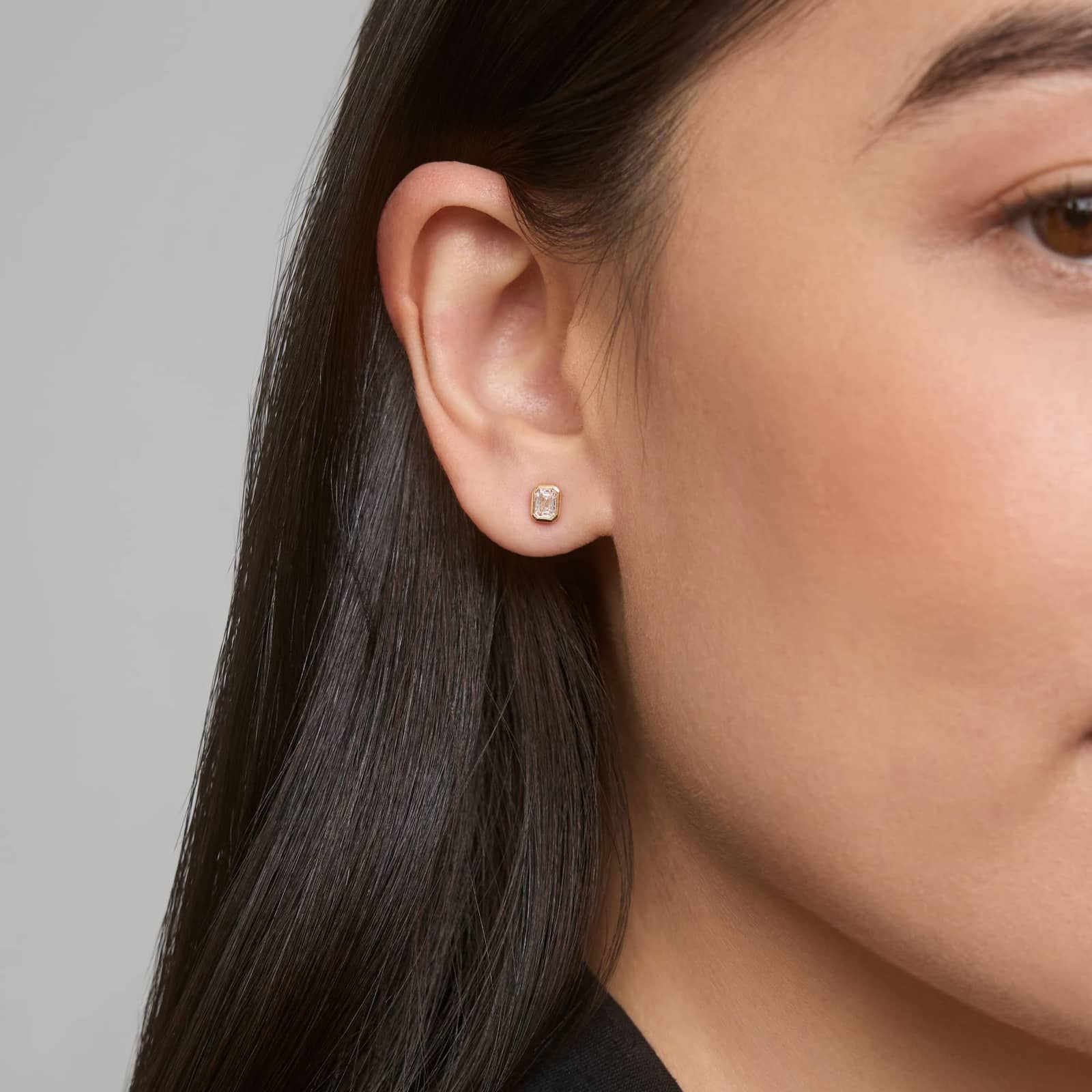 Bezel Set Emerald Cut Diamond Stud Earrings In 14K Yellow Gold (1/2 Ct. tw. - H-I / SI1-SI2)