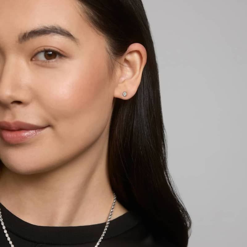 Bezel Diamond Stud Earrings With 0.25 CTW Oval Cut Diamonds in 14K White Gold