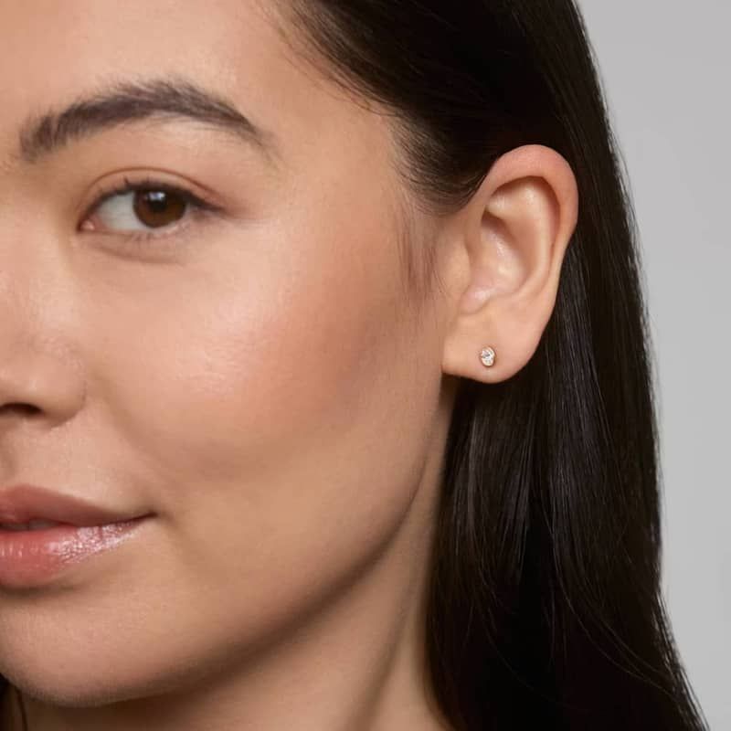 Bezel Diamond Stud Earrings With 0.25 CTW Oval Cut Diamonds in 14K Yellow Gold