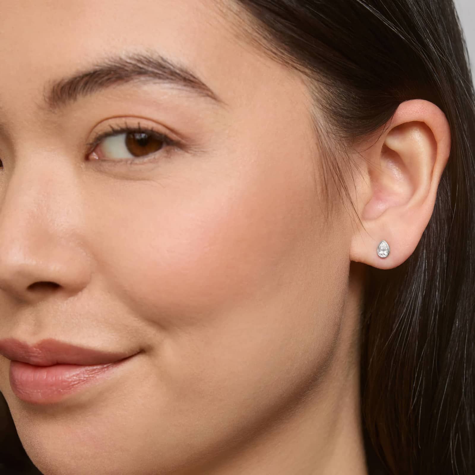 Bezel Diamond Stud Earrings With 0.5 CTW Pear Shaped Diamonds in Platinum