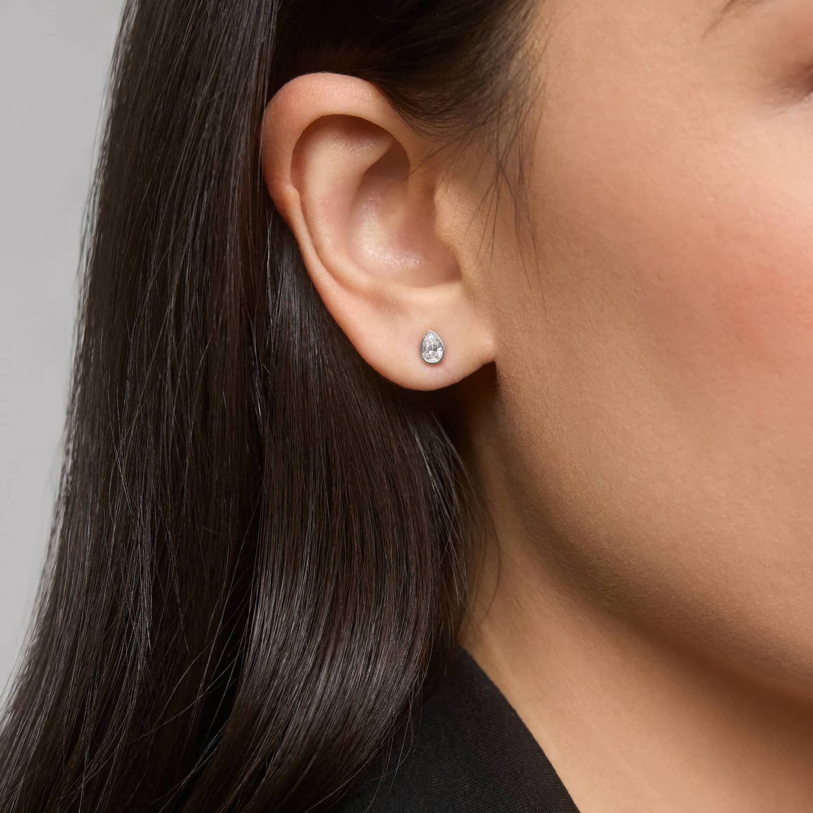 Bezel Diamond Stud Earrings With 0.5 CTW Pear Shaped Diamonds in Platinum