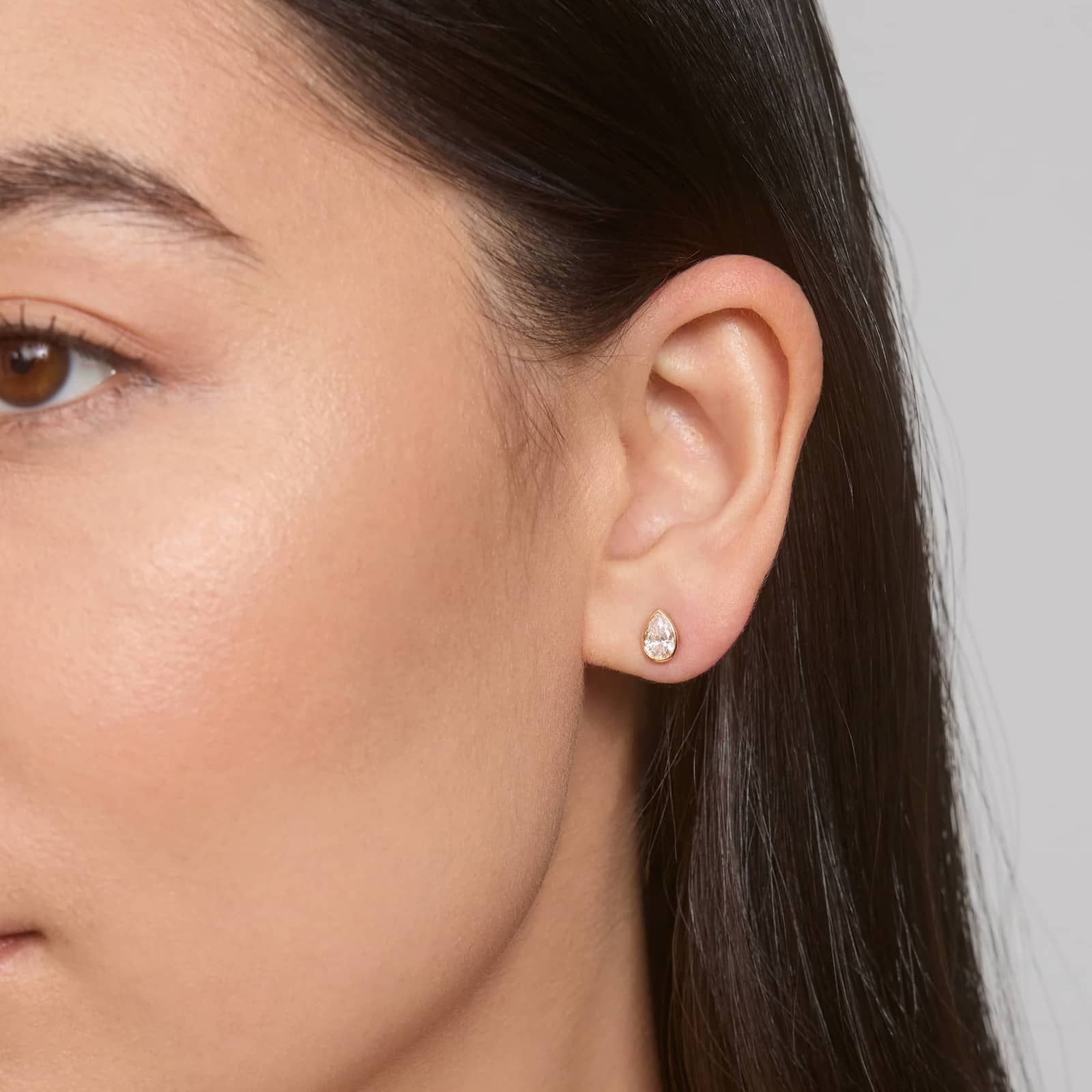 Bezel Diamond Stud Earrings With 0.75 CTW Pear Shaped Diamonds in 14K Yellow Gold