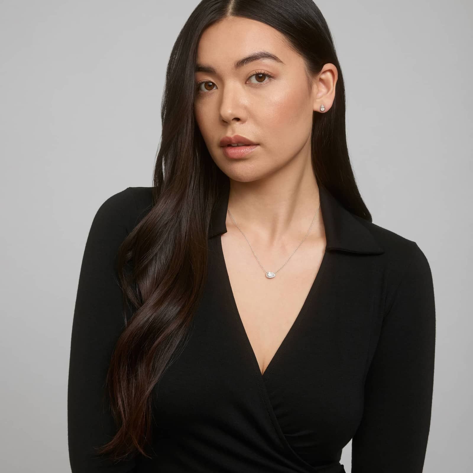 Bezel Diamond Stud Earrings With 1 CTW Pear Shaped Diamonds in Platinum