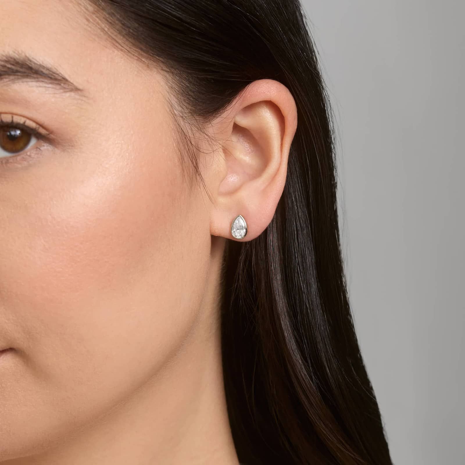 Bezel Diamond Stud Earrings With 1.5 CTW Pear Shaped Diamonds in Platinum