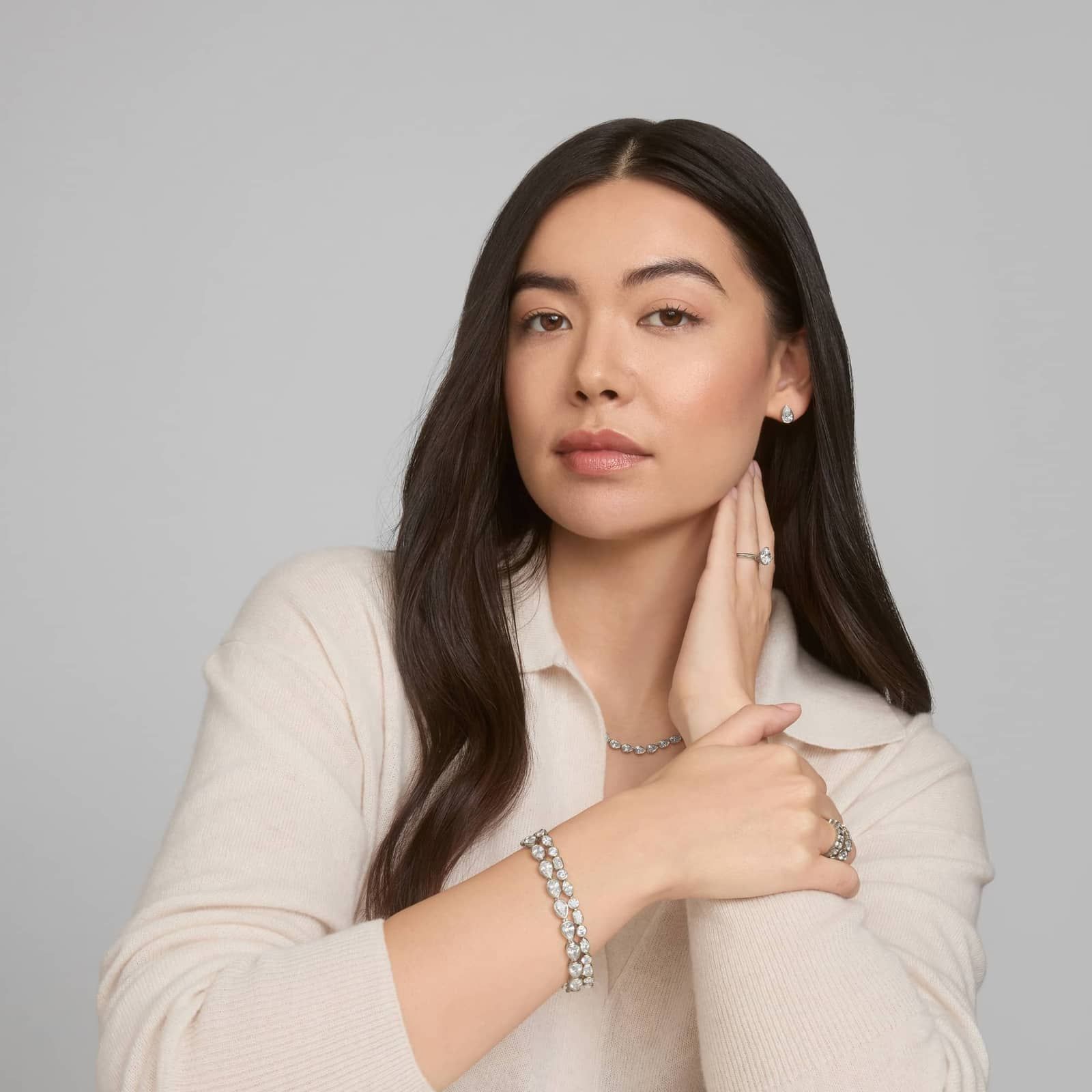 Bezel Diamond Stud Earrings With 2 CTW Pear Shaped Diamonds in Platinum