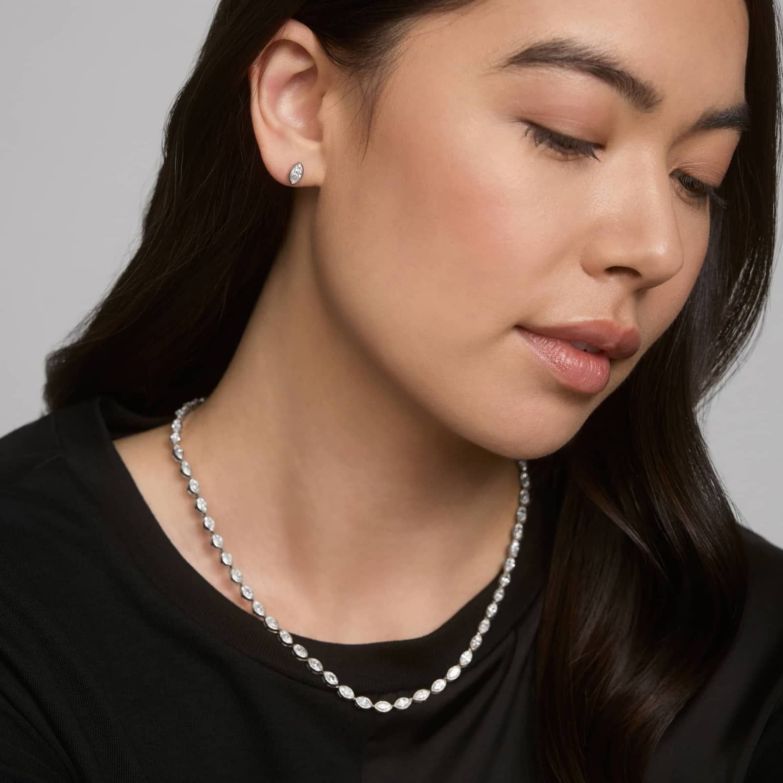 Bezel Diamond Stud Earrings With 0.75 CTW Marquise Cut Diamonds in Platinum