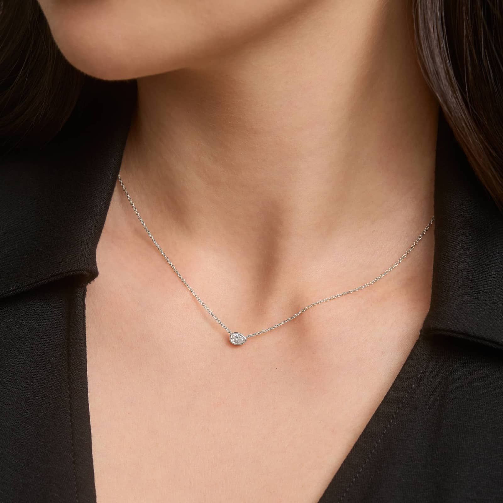 East-West Bezel Solitaire Pendant Necklace With 0.25 CTW Pear Shaped Diamond in Platinum