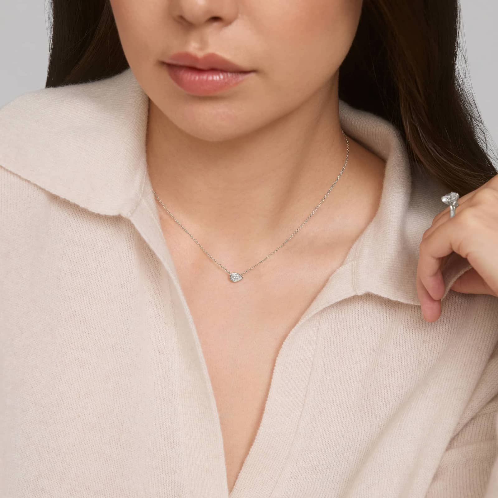 East-West Bezel Solitaire Pendant Necklace With 0.5 CTW Pear Shaped Lab-Grown Diamond in 14K White Gold