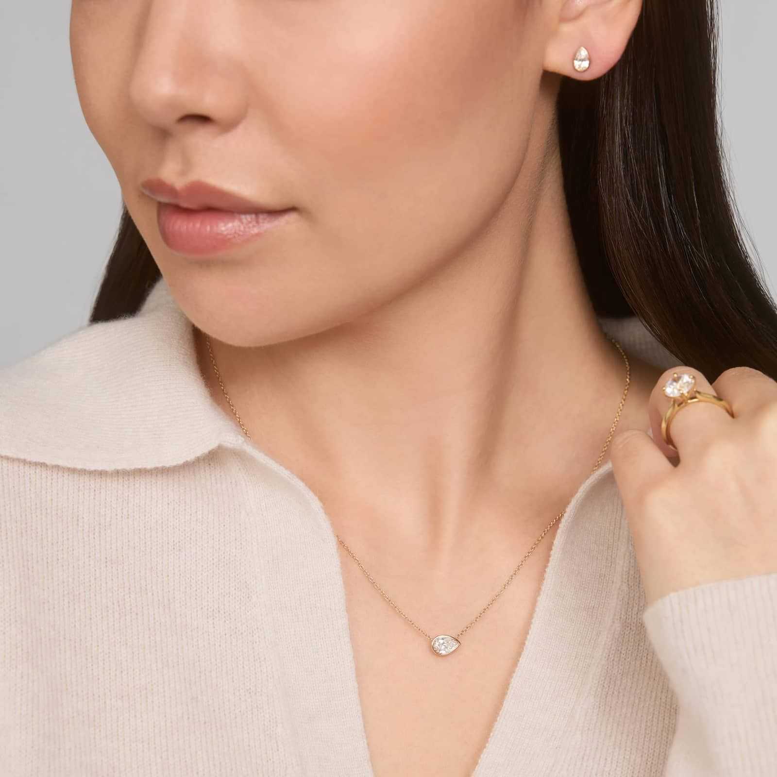 East-West Bezel Solitaire Pendant Necklace With 0.75 CTW Pear Shaped Lab-Grown Diamond in 14K Yellow Gold