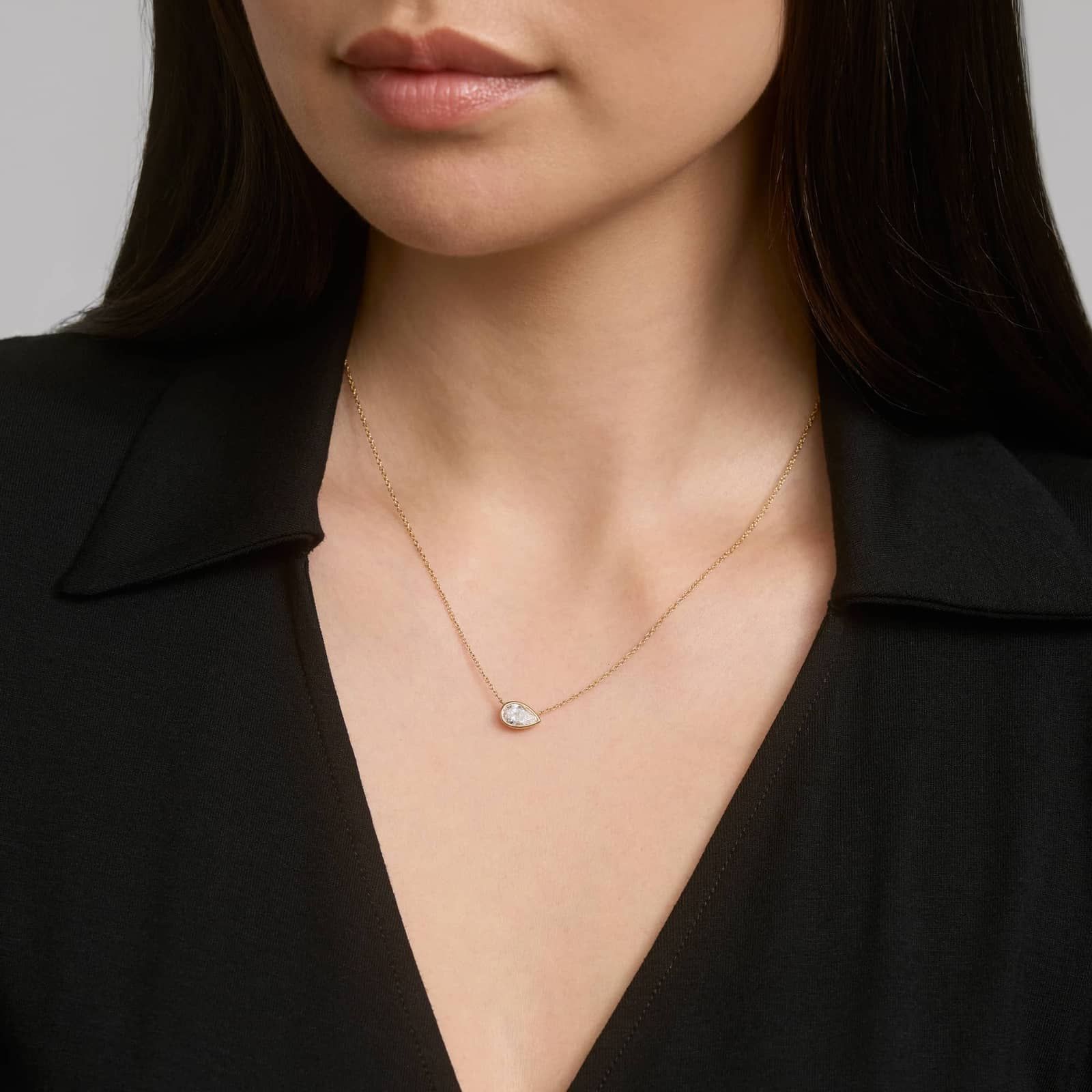 East-West Bezel Solitaire Pendant Necklace With 1 CTW Pear Shaped Lab-Grown Diamond in 14K Yellow Gold
