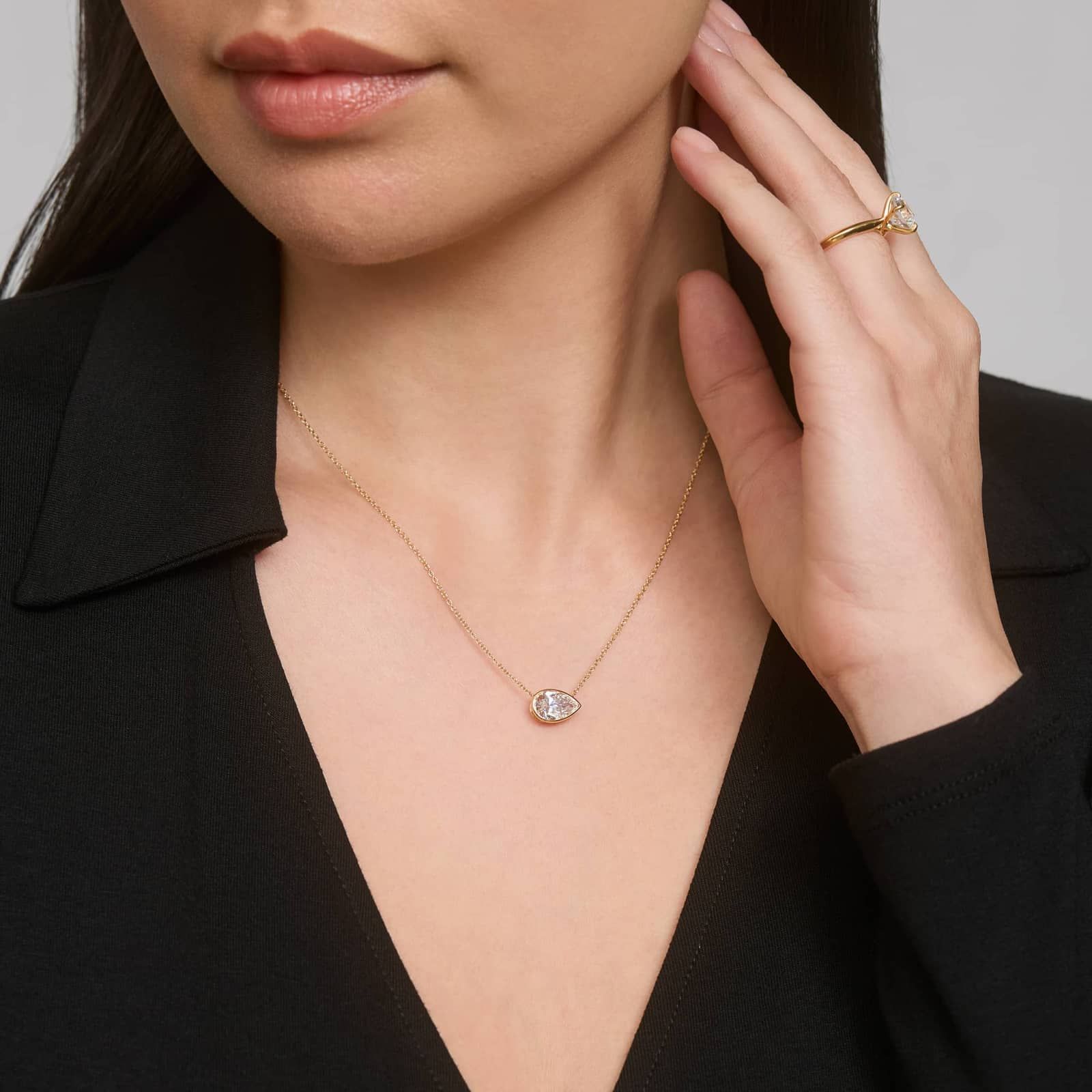 East-West Bezel Solitaire Pendant Necklace With 1.5 CTW Pear Shaped Lab-Grown Diamond in 14K Yellow Gold