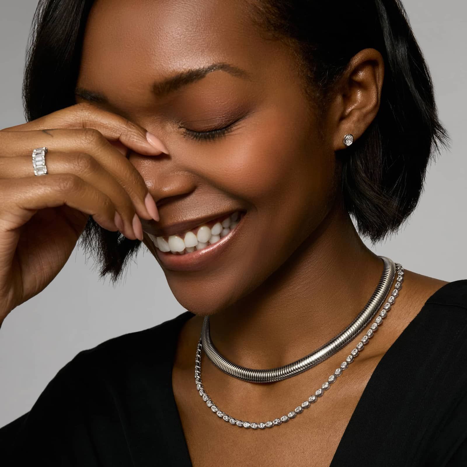 East-West Bezel Tennis Necklace With 15 CTW Oval Cut Diamonds in Platinum