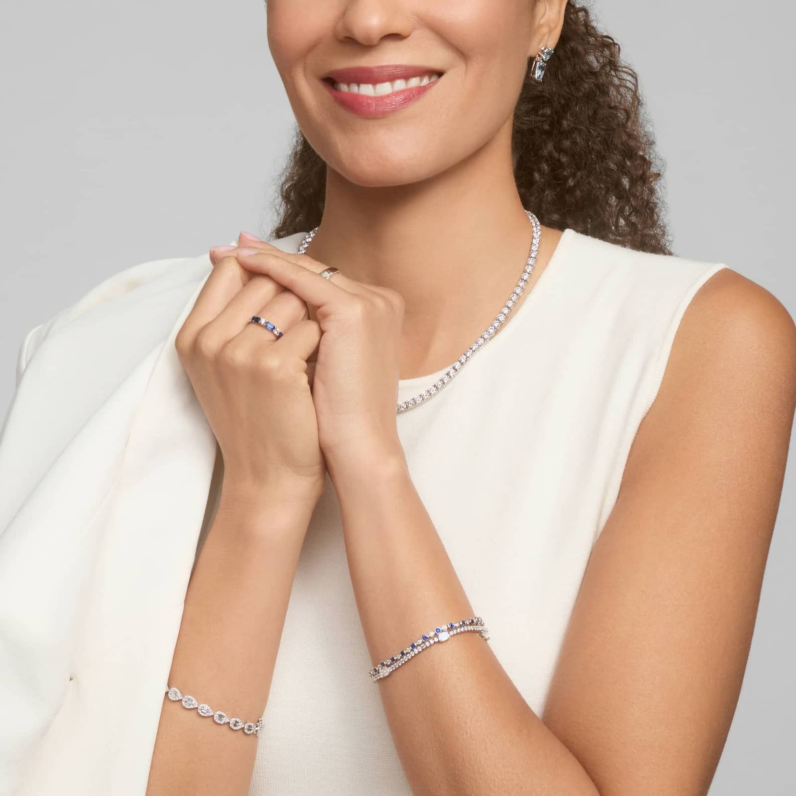 Alternating Blue Sapphire and Diamond Bracelet with 0.75 CTW Round Cut Diamonds in 14K White Gold Bezel Setting