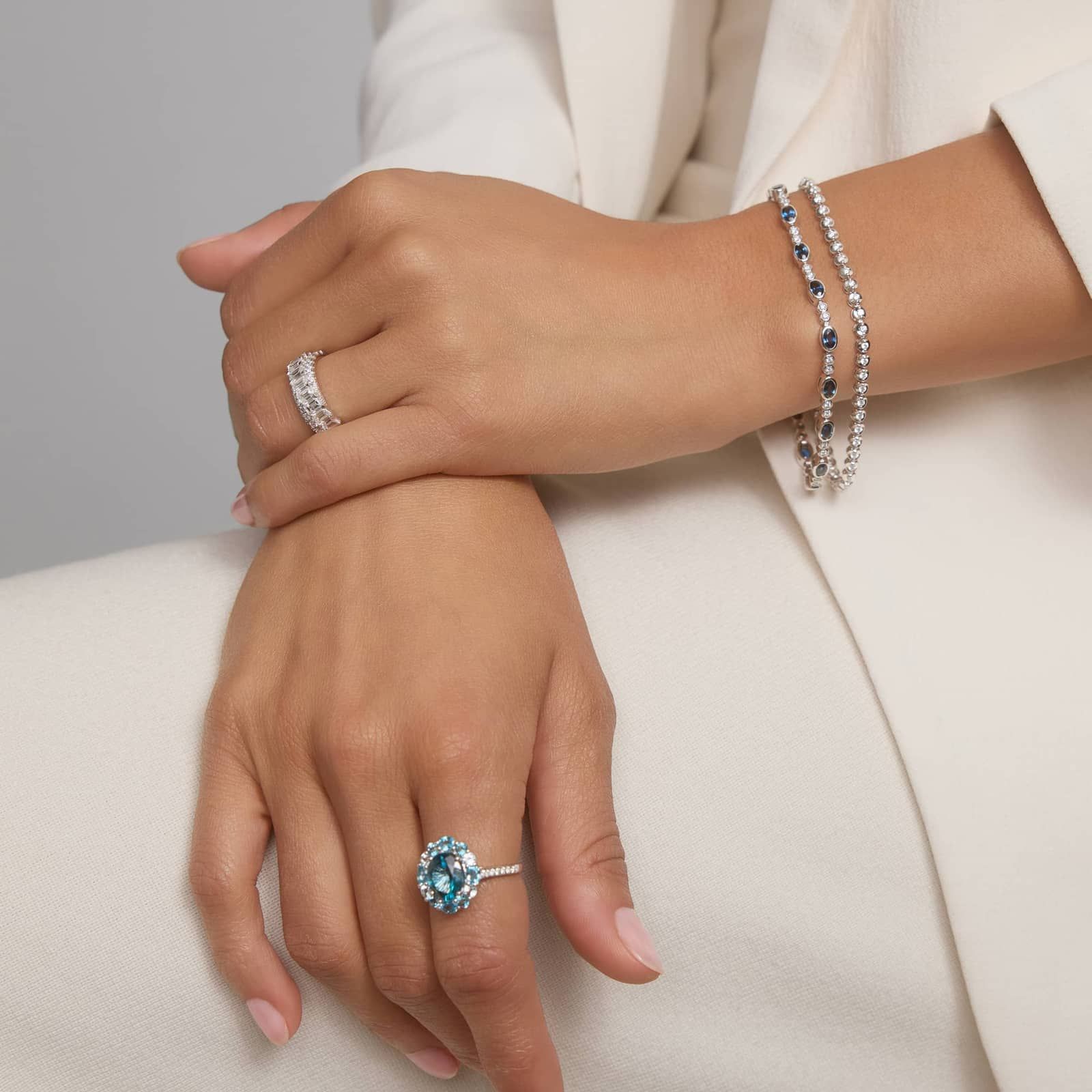 Alternating Oval Cut Blue Sapphire and Diamond Bracelet with 0.3 CTW Round Cut Diamonds in 14K White Gold Bezel Setting