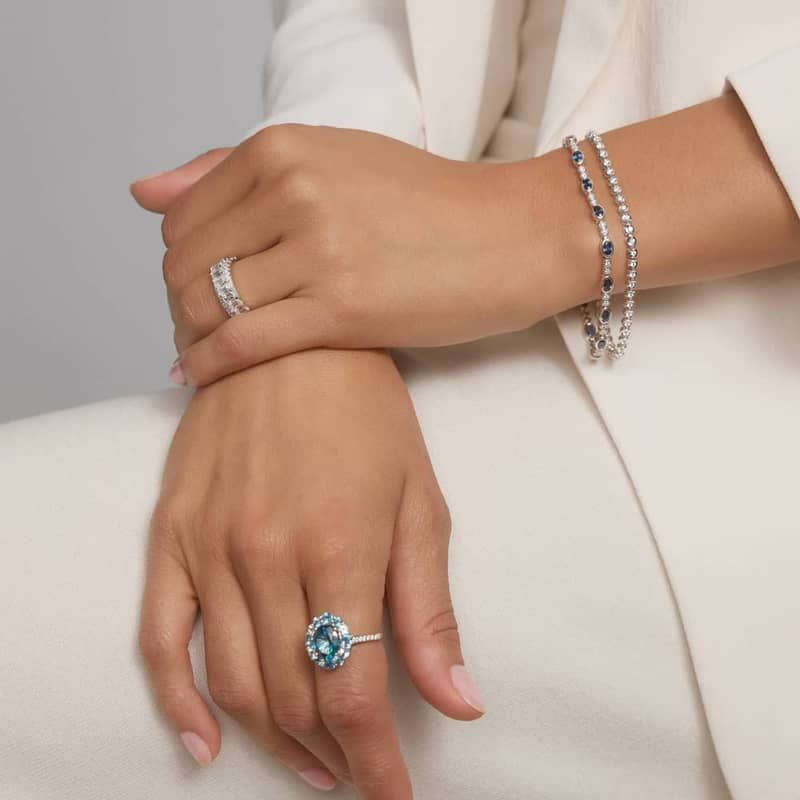 Alternating Oval Cut Blue Sapphire and Diamond Bracelet with 0.3 CTW Round Cut Diamonds in 14K White Gold Bezel Setting