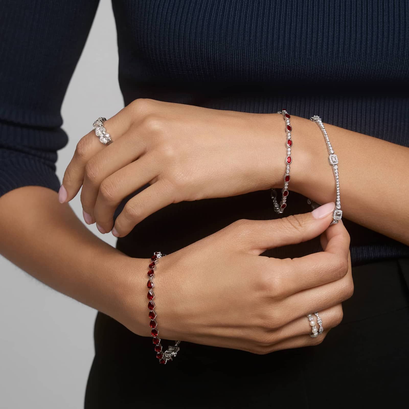 Alternating Oval Cut Ruby and Diamond Bracelet with 0.3 CTW Round Cut Diamonds in 14K White Gold Bezel Setting