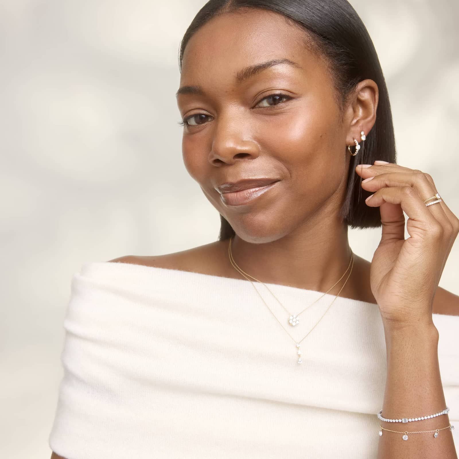 Center Diamond Huggie Earrings with 1 CTW Round Cut Diamonds in 14K Yellow Gold