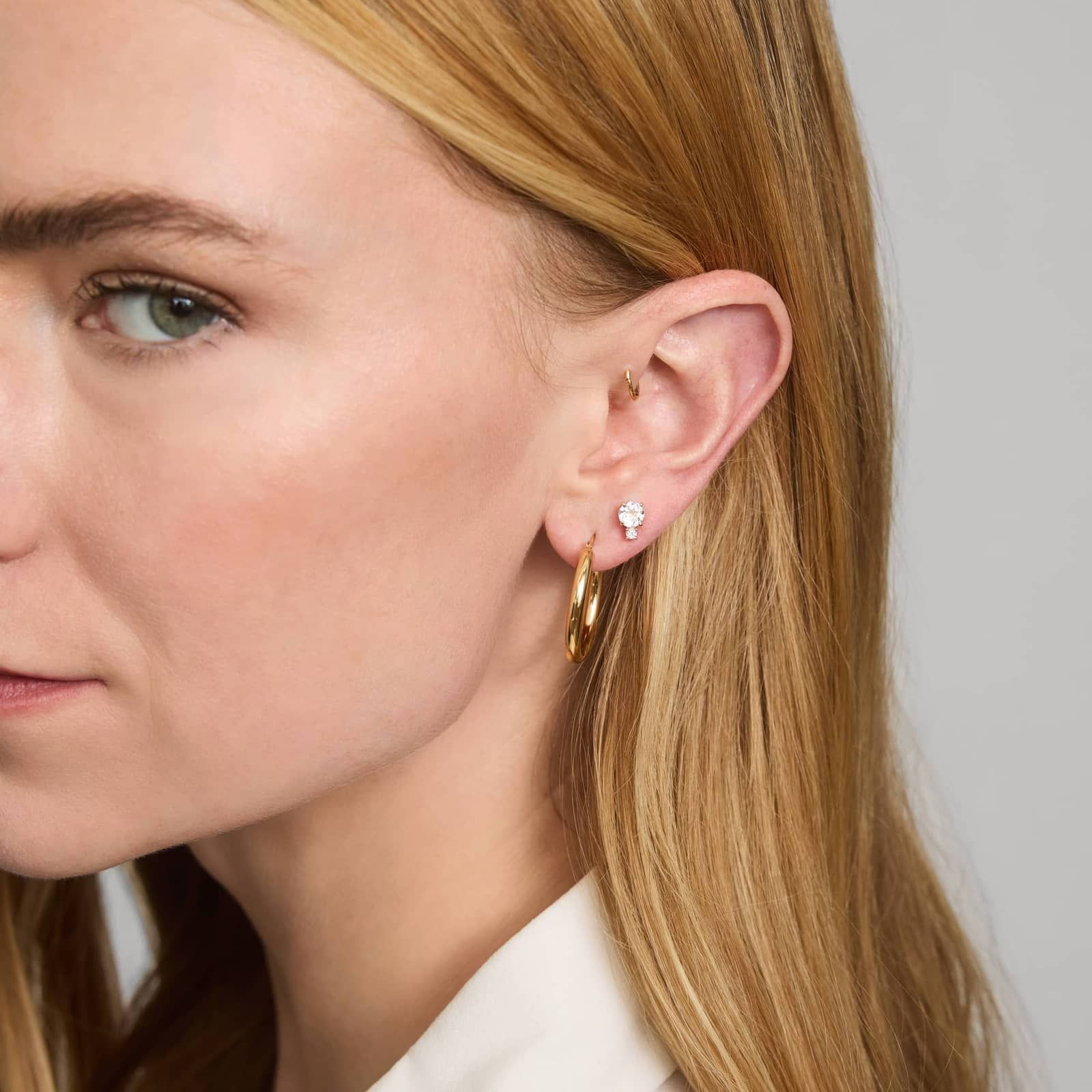 White Topaz Stud Earrings with Diamond Accent in 14K Yellow Gold