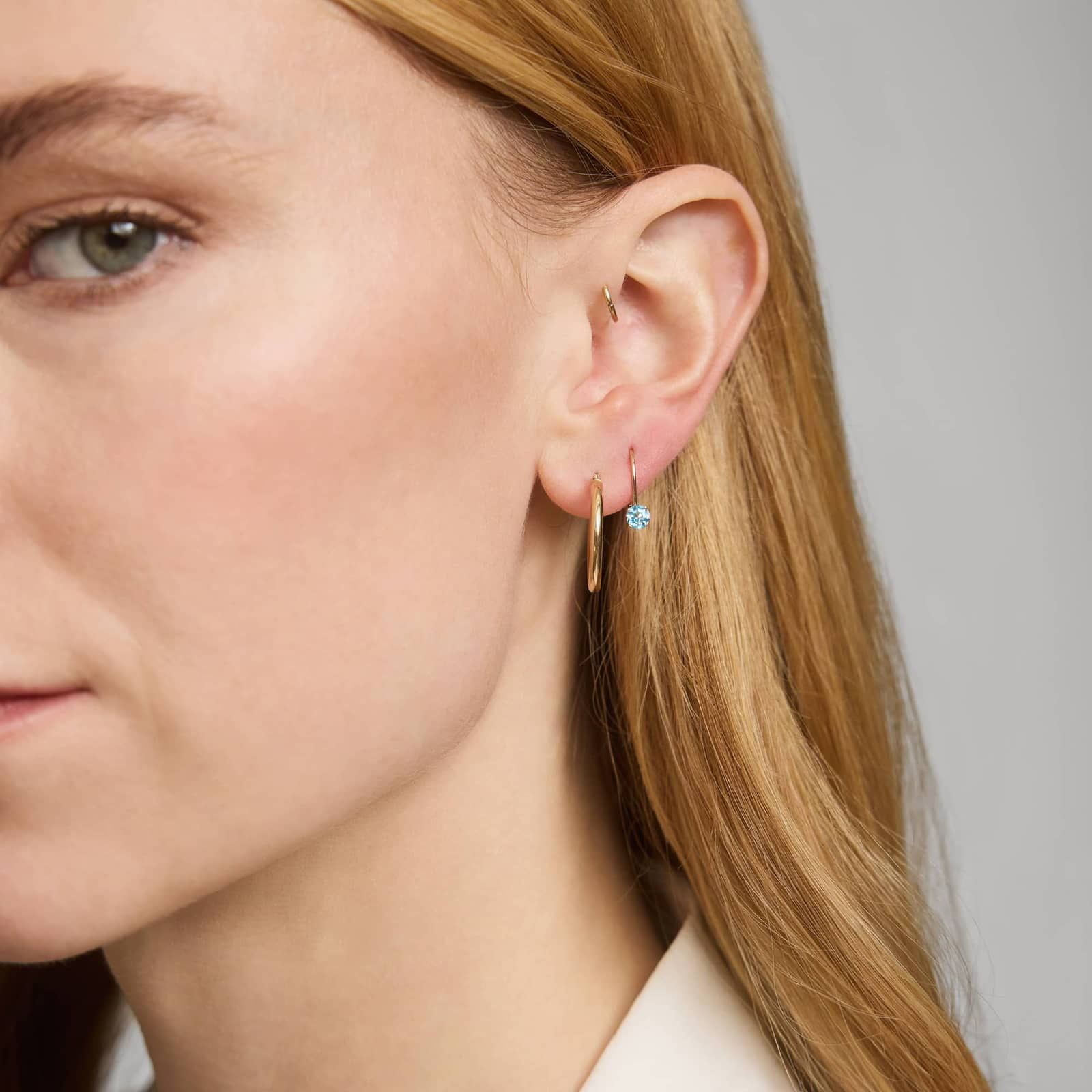 Blue Topaz Leverback Earrings in 14K Yellow Gold