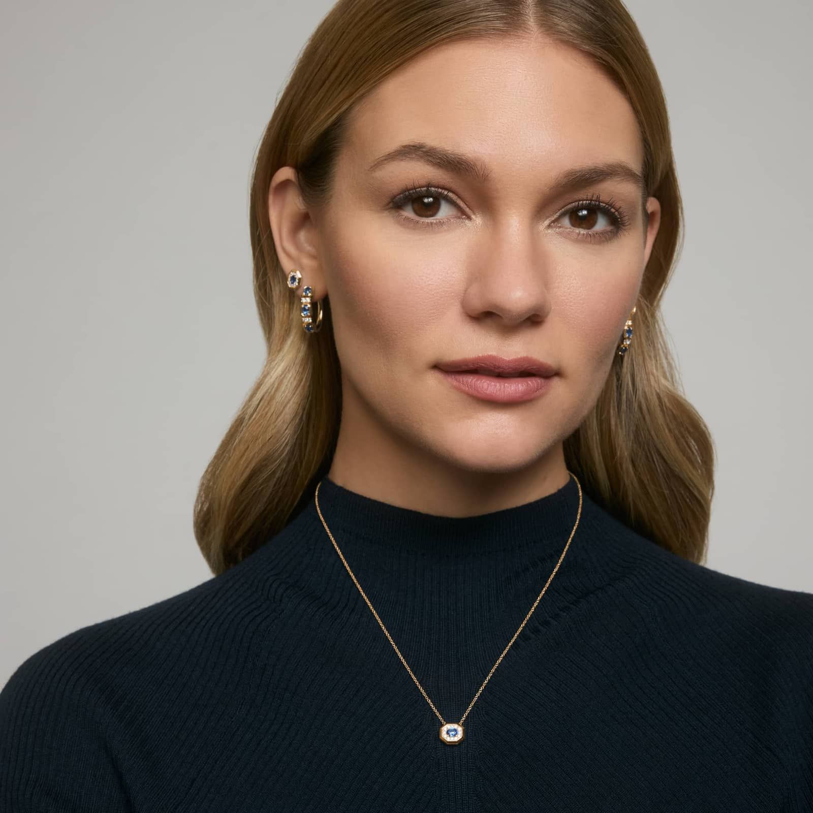 Oval Cut Blue Sapphire and Pavé Diamond Stud Earrings In 14K Yellow Gold