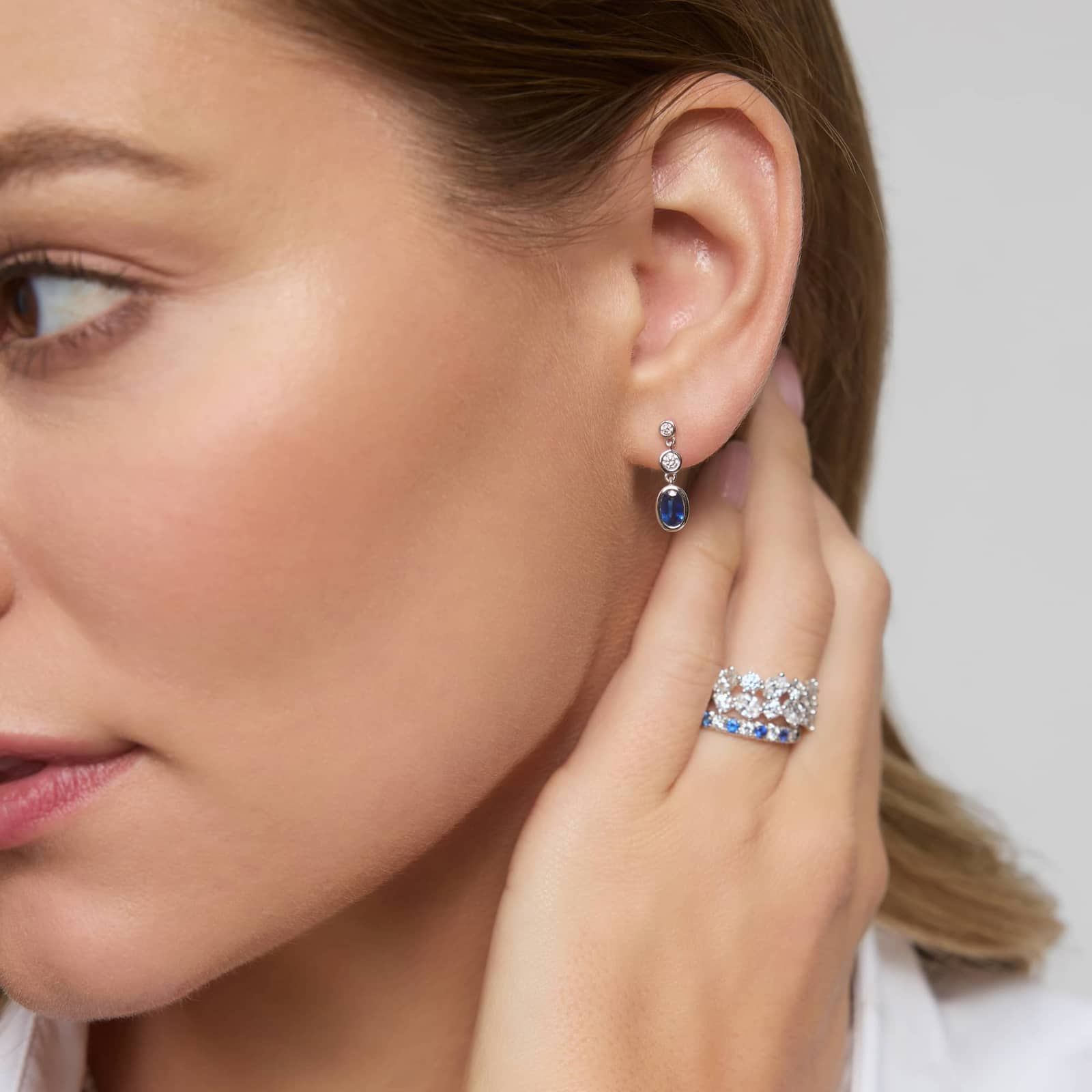 Blue Sapphire and Diamond Drop Earrings with 0.25 CTW Round Cut Diamonds in 14K White Gold Bezel Setting