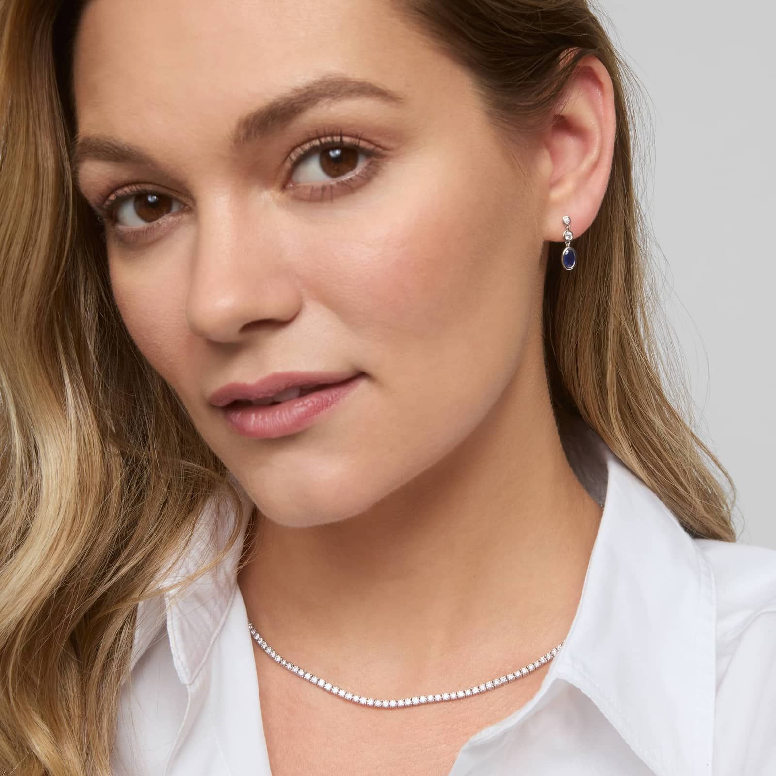 Blue Sapphire and Diamond Drop Earrings with 0.25 CTW Round Cut Diamonds in 14K White Gold Bezel Setting