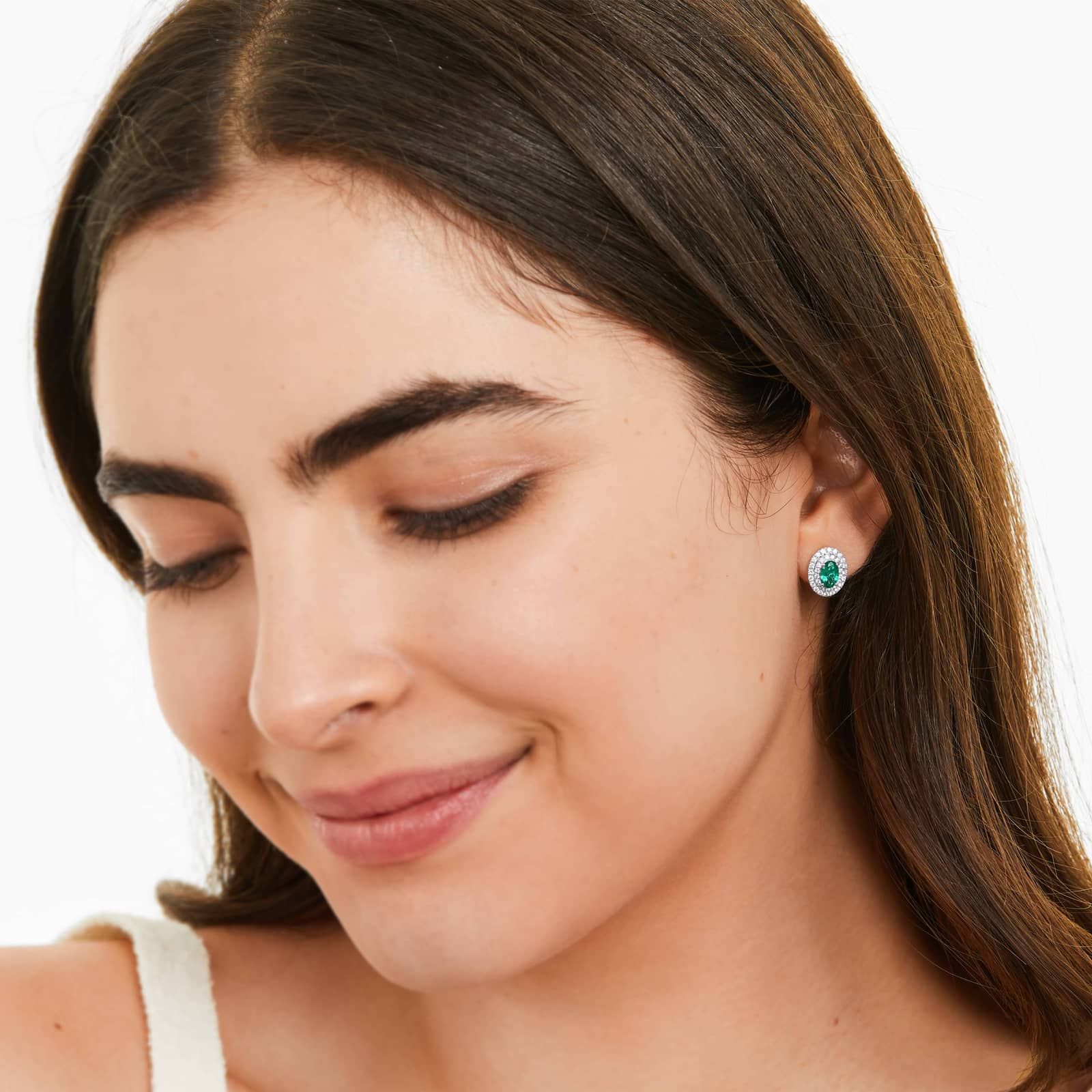 Oval Cut Emerald And Diamond Double Halo Earrings In 18K White Gold