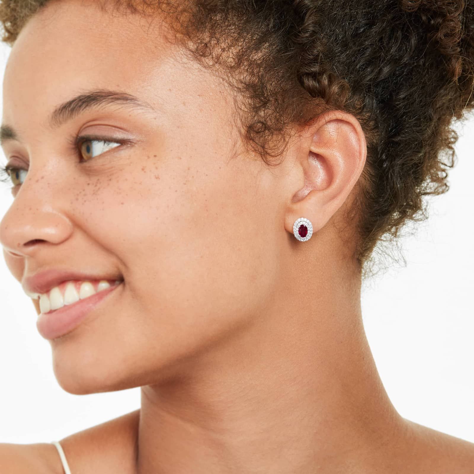 Oval Cut Ruby And Diamond Double Halo Earrings In 18K White Gold