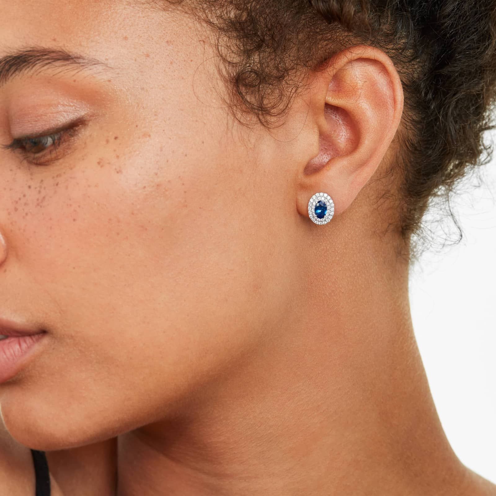 Oval Cut Sapphire And Diamond Double Halo Earrings In 18K White Gold