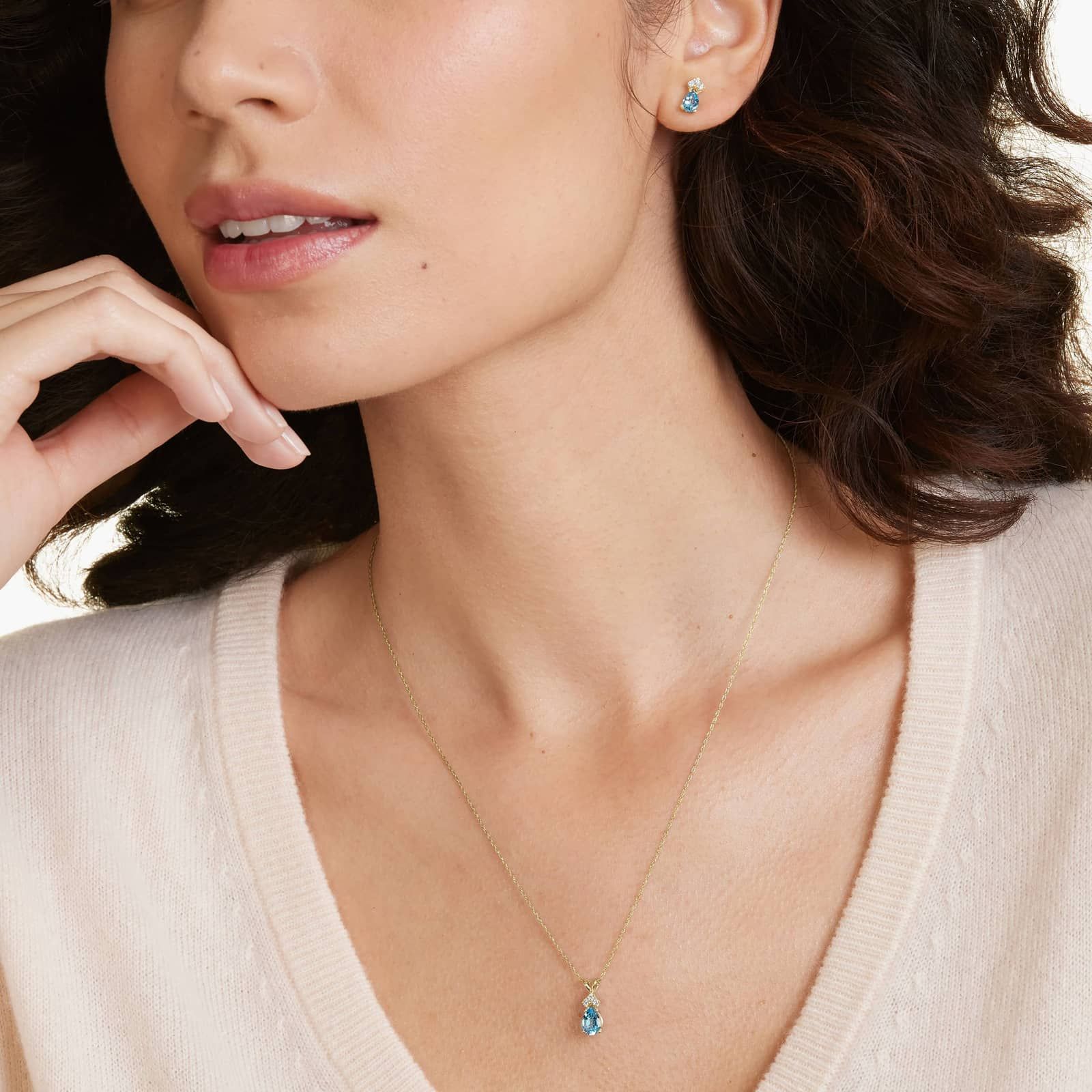 Pear Shape Swiss Blue Topaz And Tri-Diamond Stud Earrings In 14K Yellow Gold