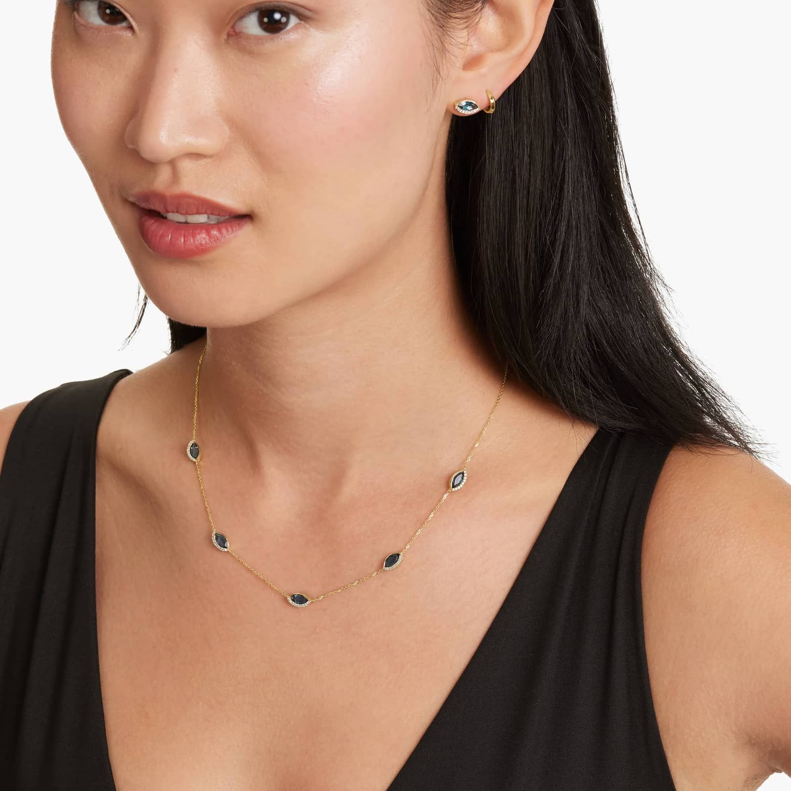 Radiant Reflections Marquise Cut Blue Topaz Earrings In 14K Yellow Gold