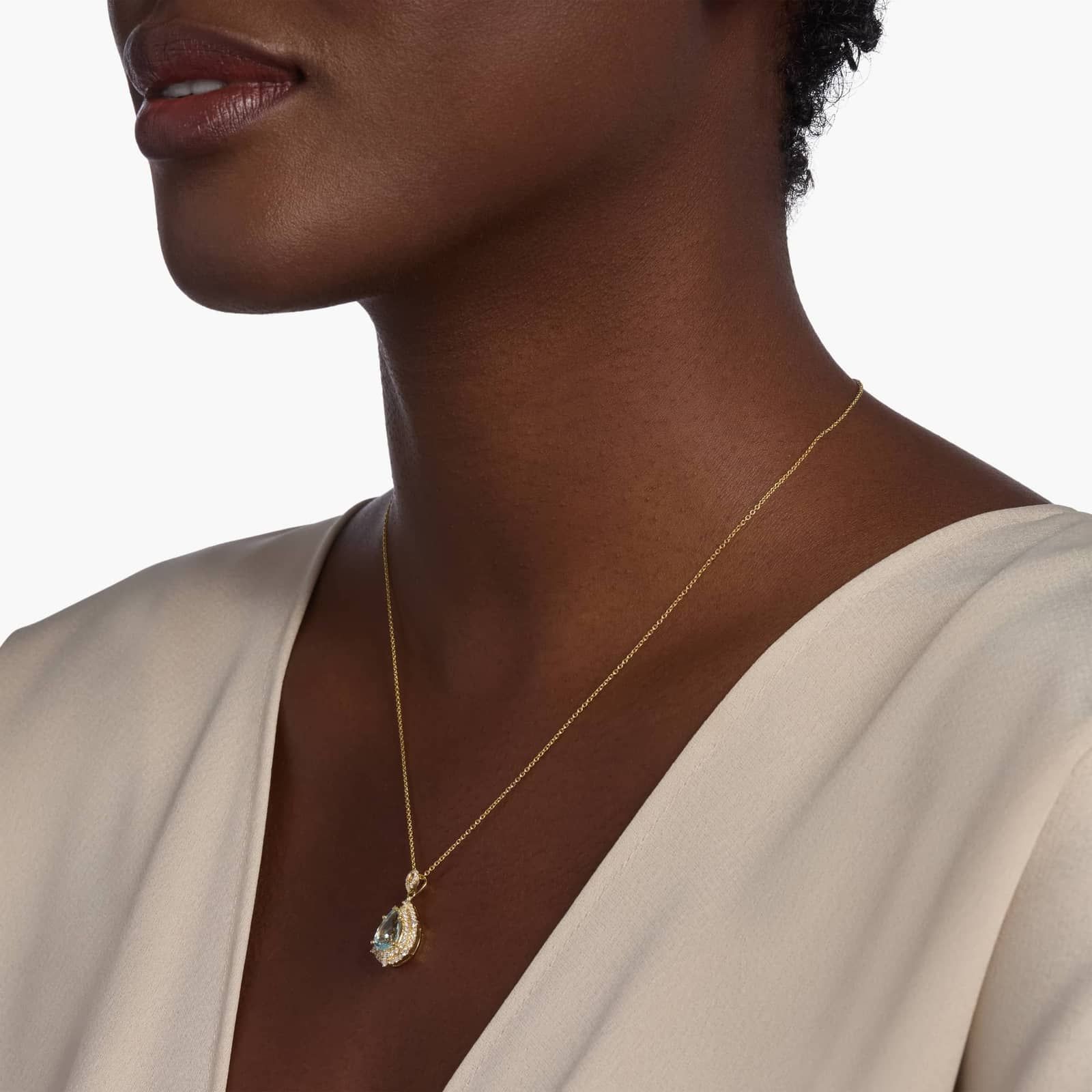 Pear Shaped Aquamarine and Diamond Double Halo Pendant in 14k Yellow Gold