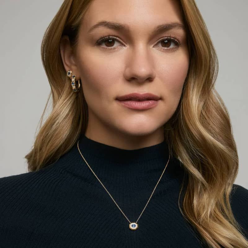 Oval Cut Blue Sapphire and Pavé Diamond Pendant Necklace In 14K Yellow Gold