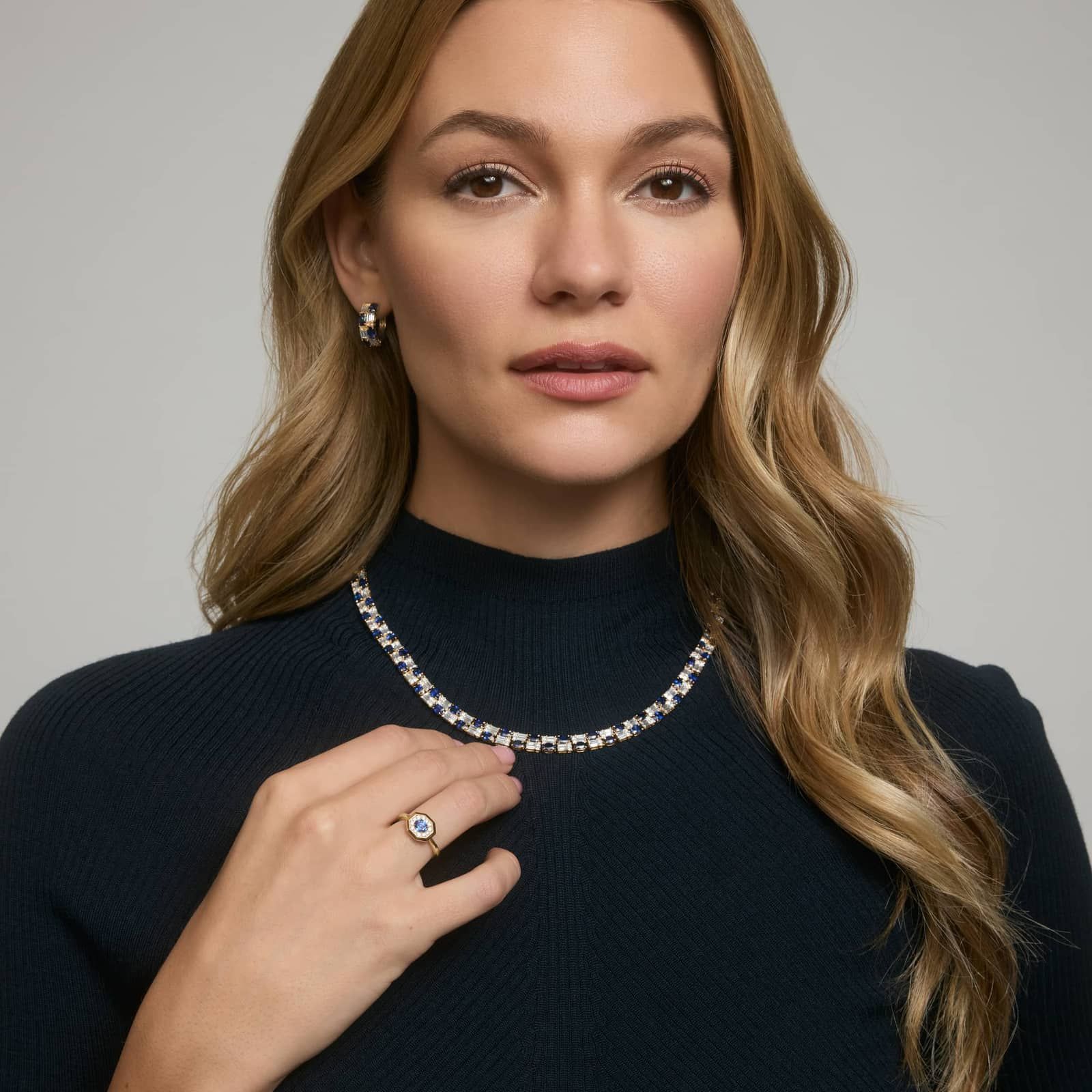 East-West Oval Cut Blue Sapphire and Pavé Diamond Ring In 14K Yellow Gold