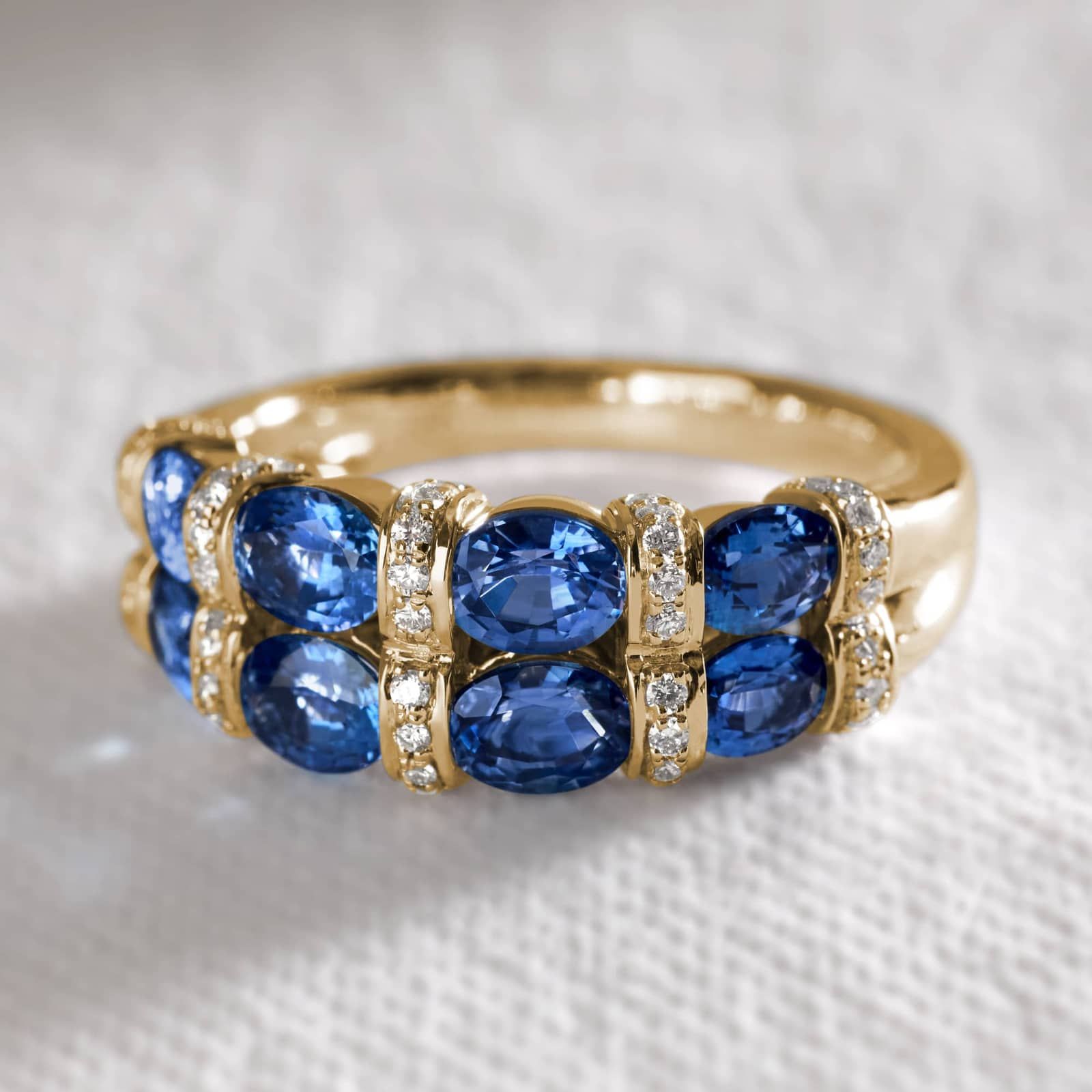 East-West Double Row Oval Cut Blue Sapphire and Pavé Diamond Ring In 14K Yellow Gold (7.55mm)