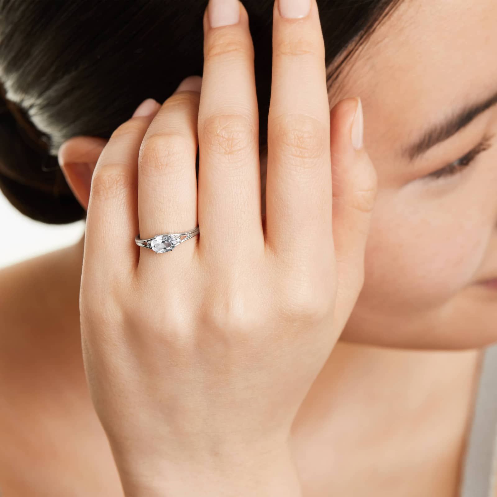 Oval White Topaz And Diamond Accent Birthstone Ring In 14K White Gold