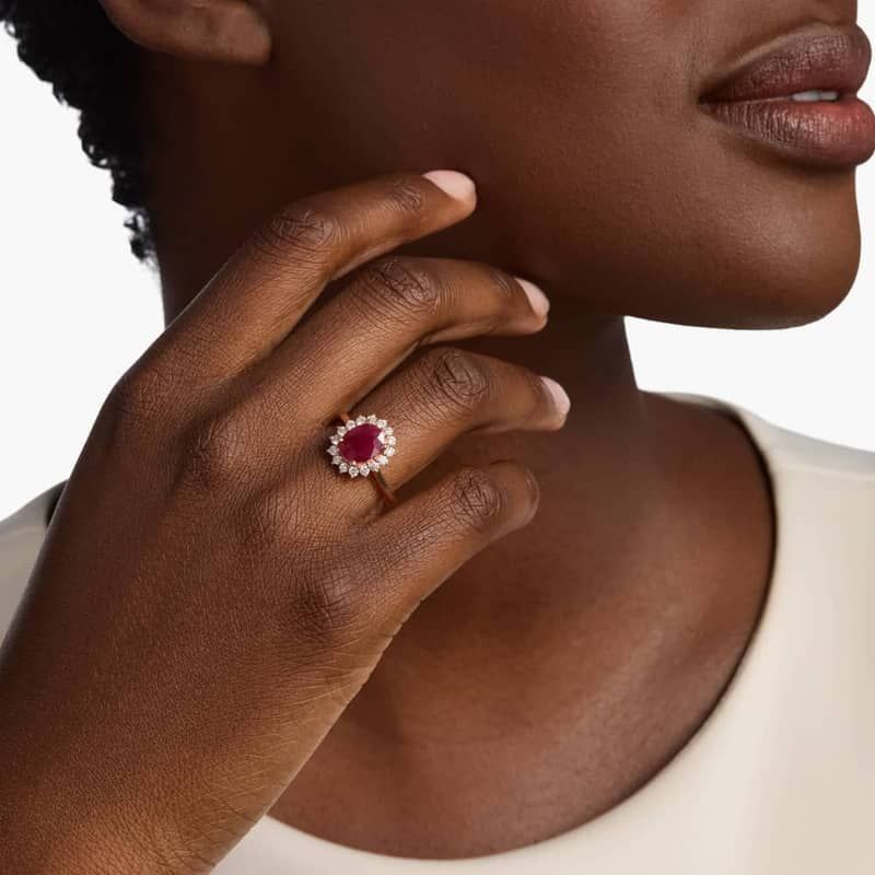 Oval Ruby and Diamond Sunburst Halo Ring in 14k Rose Gold (9x7mm)