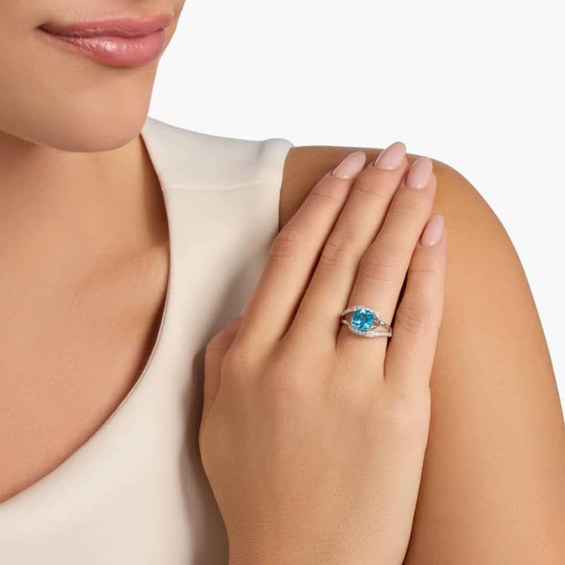 Cushion Cut Swiss Blue Topaz Ring with Twisting Halo in 14k White Gold