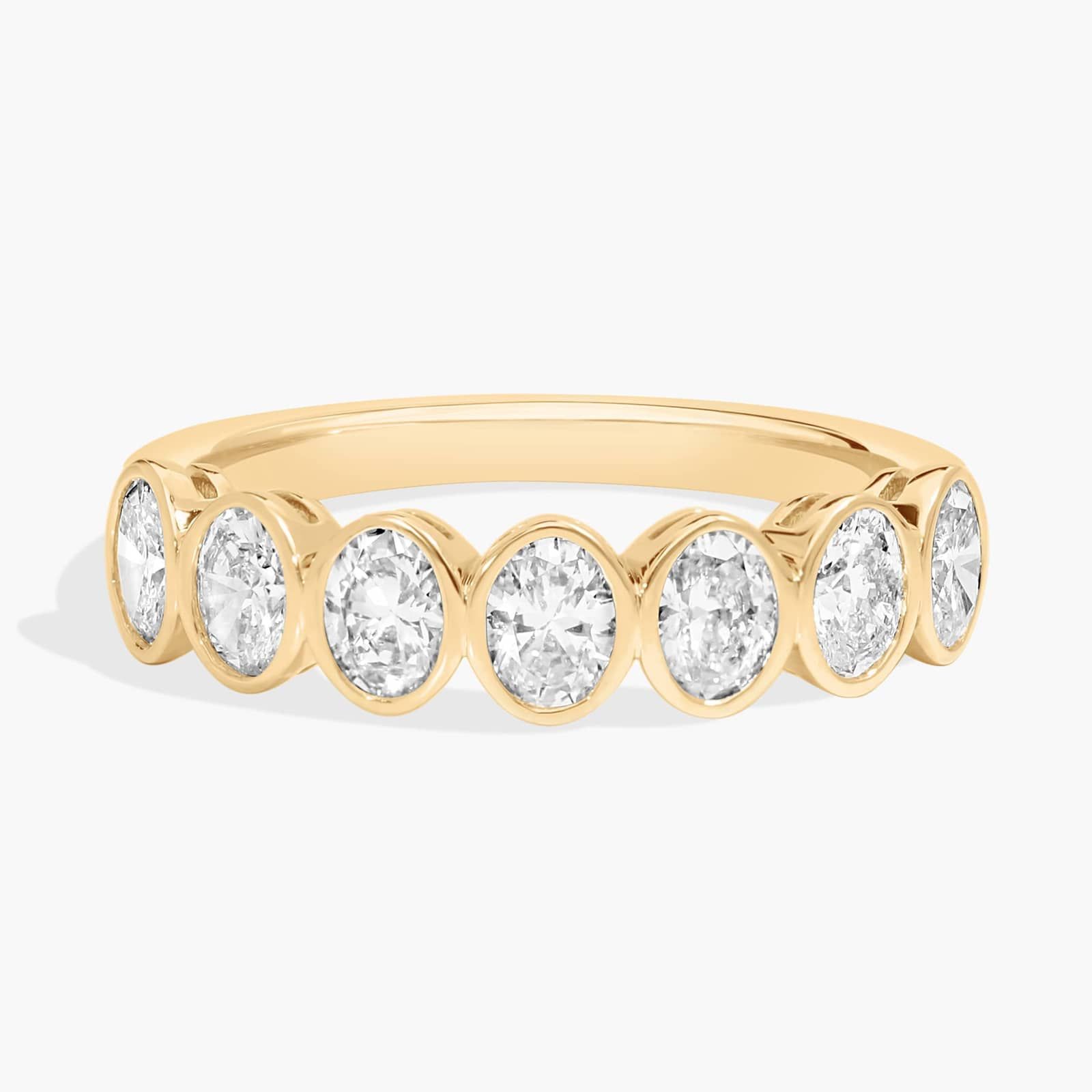 Seven Stone Bezel Anniversary Ring With 1 CTW Oval Cut Diamonds in 14K Yellow Gold (4.65mm)