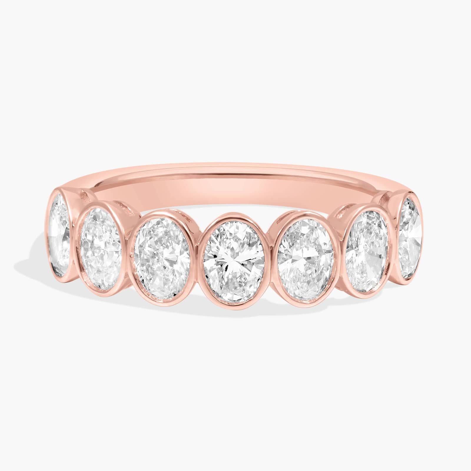 Seven Stone Bezel Anniversary Ring With 1.5 CTW Oval Cut Diamonds in 14K Rose Gold (5mm)